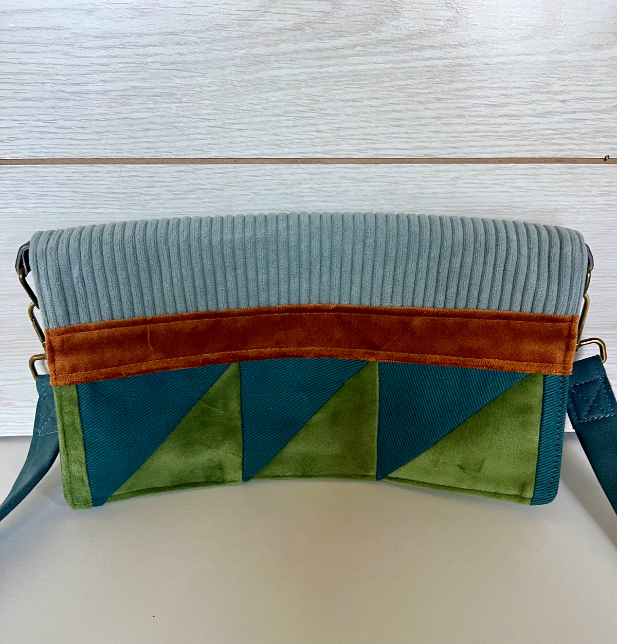 La pochette bleu-vert